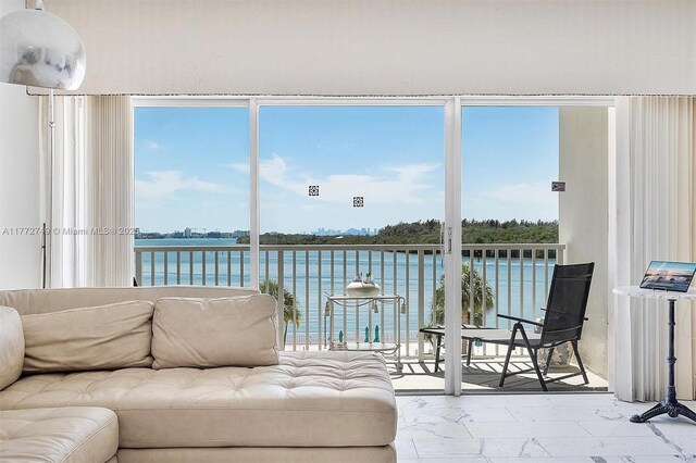 300 Bayview Dr Unit 308, Sunny Isles Beach, FL 33160 - sunroom with a water view and plenty of natural light