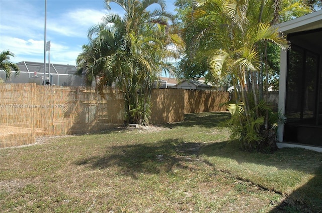 view of yard with a fenced backyard