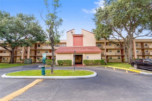3199 Foxcroft Rd Unit 311, Miramar, FL 33025 - view of building exterior with uncovered parking