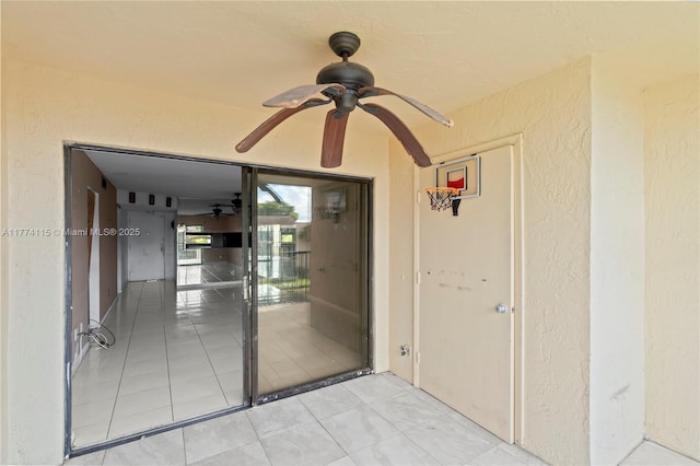 3199 Foxcroft Rd Unit 311, Miramar, FL 33025 - property entrance featuring ceiling fan and stucco siding