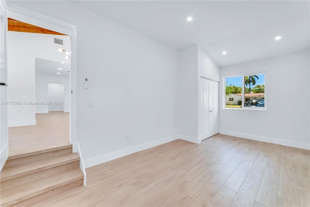 unfurnished room featuring baseboards, recessed lighting, visible vents, and light wood-style floors