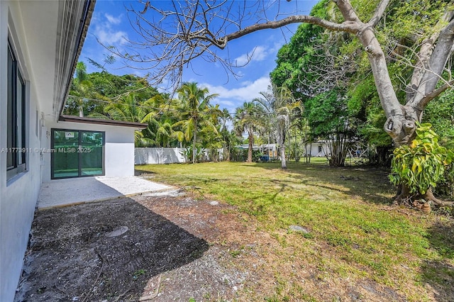 121 NW 35th St, Oakland Park, FL 33309 - view of yard featuring fence and a patio