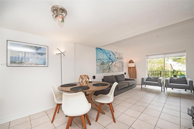 6709 N Kendall Dr Unit 227, Pinecrest, FL 33156 - dining room featuring light tile patterned floors and baseboards