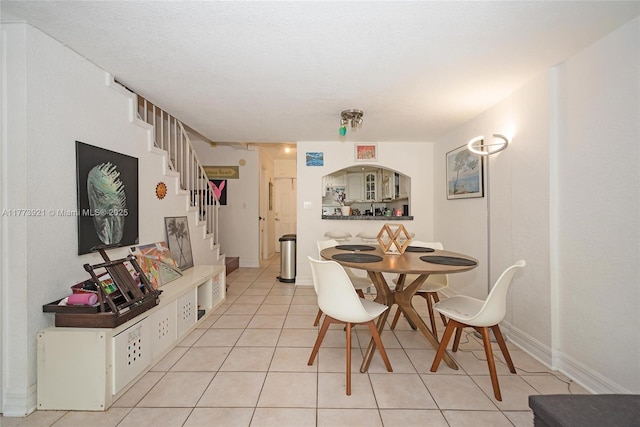 6709 N Kendall Dr Unit 227, Pinecrest, FL 33156 - dining area with stairs and light tile patterned flooring
