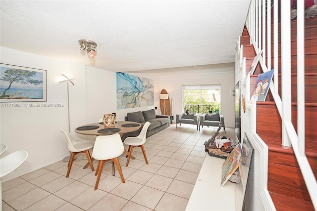 6709 N Kendall Dr Unit 227, Pinecrest, FL 33156 - dining area featuring light tile patterned floors, a textured ceiling, and baseboards