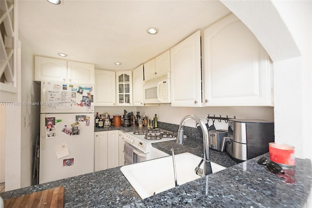 6709 N Kendall Dr Unit 227, Pinecrest, FL 33156 - kitchen featuring white appliances, recessed lighting, dark stone counters, white cabinets, and glass insert cabinets