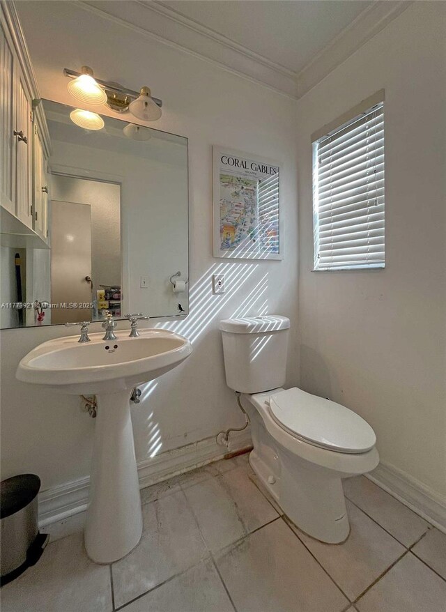 6709 N Kendall Dr Unit 227, Pinecrest, FL 33156 - bathroom featuring crown molding, toilet, tile patterned flooring, baseboards, and a sink
