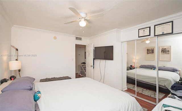 6709 N Kendall Dr Unit 227, Pinecrest, FL 33156 - bedroom with crown molding, a closet, ceiling fan, and wood finished floors