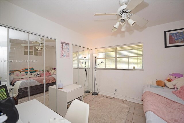 6709 N Kendall Dr Unit 227, Pinecrest, FL 33156 - bedroom featuring light tile patterned floors, a ceiling fan, and baseboards