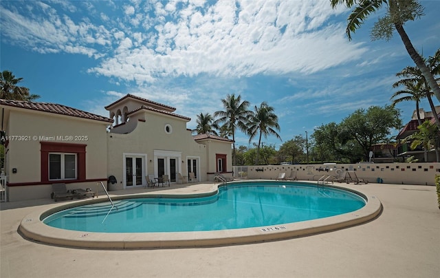 6709 N Kendall Dr Unit 227, Pinecrest, FL 33156 - community pool with french doors and a patio area