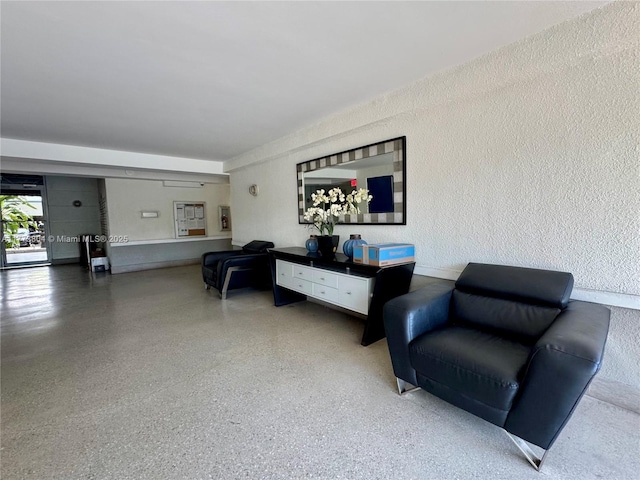 living area with speckled floor