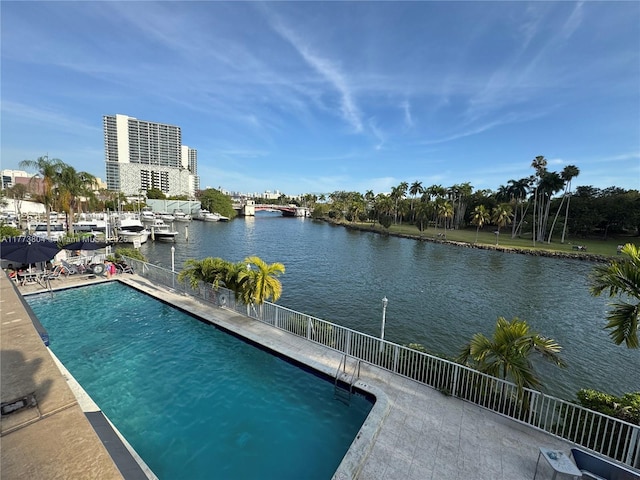 view of pool featuring a water view