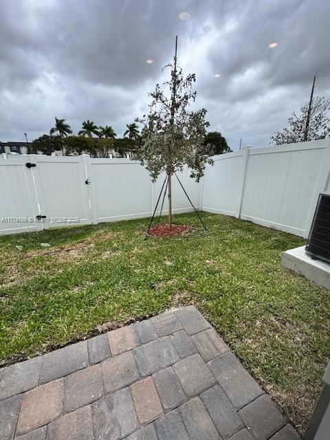 view of yard featuring a patio and a fenced backyard