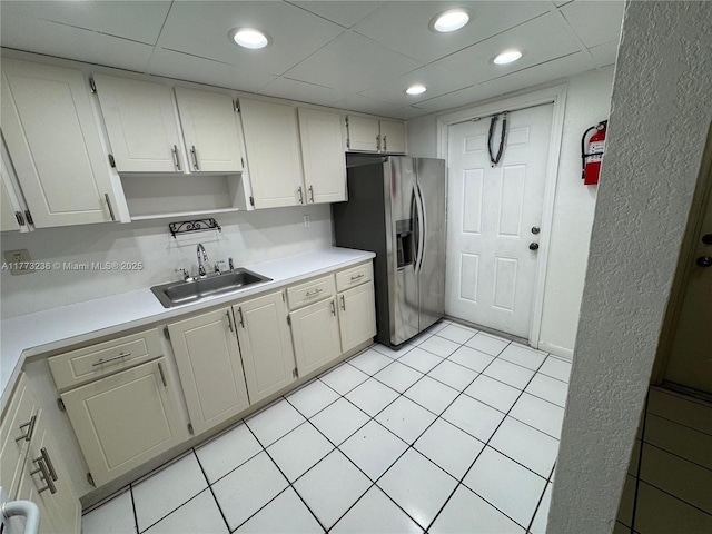505 NW 177th St Unit 103, Miami Gardens, FL 33169 - kitchen featuring recessed lighting, light countertops, a sink, and stainless steel refrigerator with ice dispenser