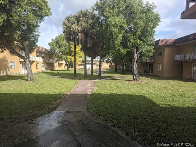 505 NW 177th St Unit 103, Miami Gardens, FL 33169 - view of property's community featuring a residential view and a yard