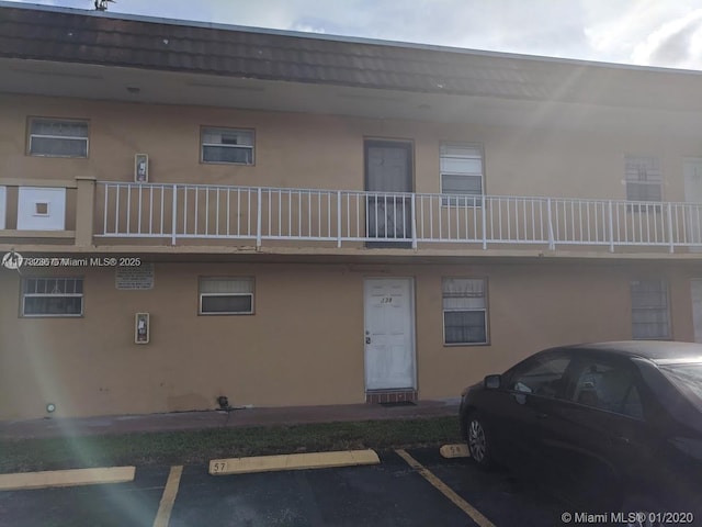 505 NW 177th St Unit 103, Miami Gardens, FL 33169 - view of building exterior with uncovered parking