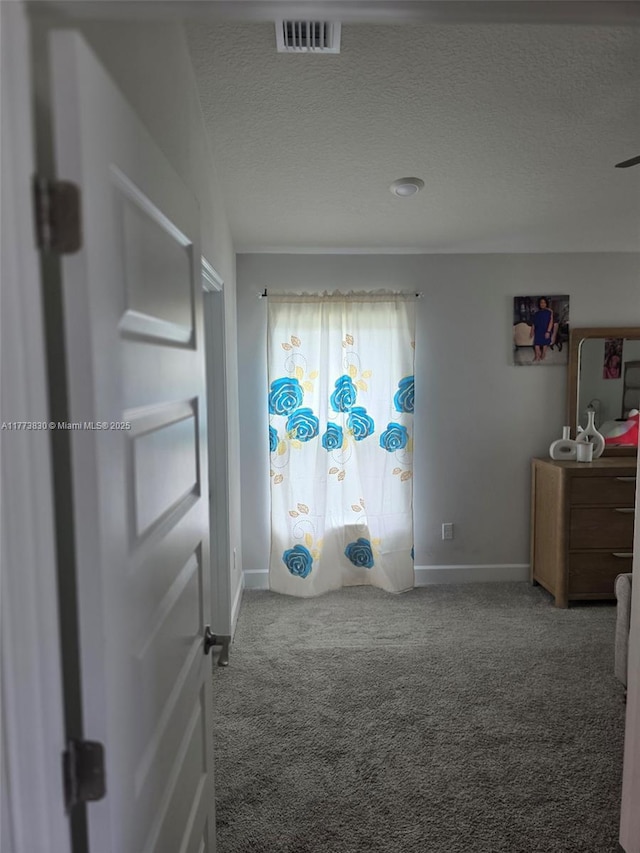 5317 Lugo St, Fort Pierce, FL 34951 - bedroom featuring baseboards, visible vents, carpet floors, and a textured ceiling