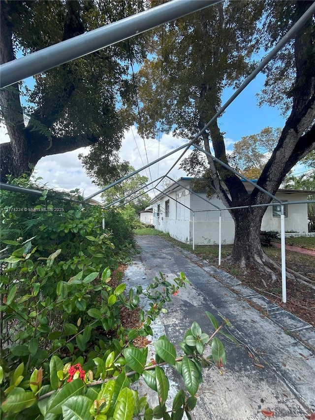 3401 SW 14th St, Miami, FL 33145 - view of home's exterior featuring asphalt driveway