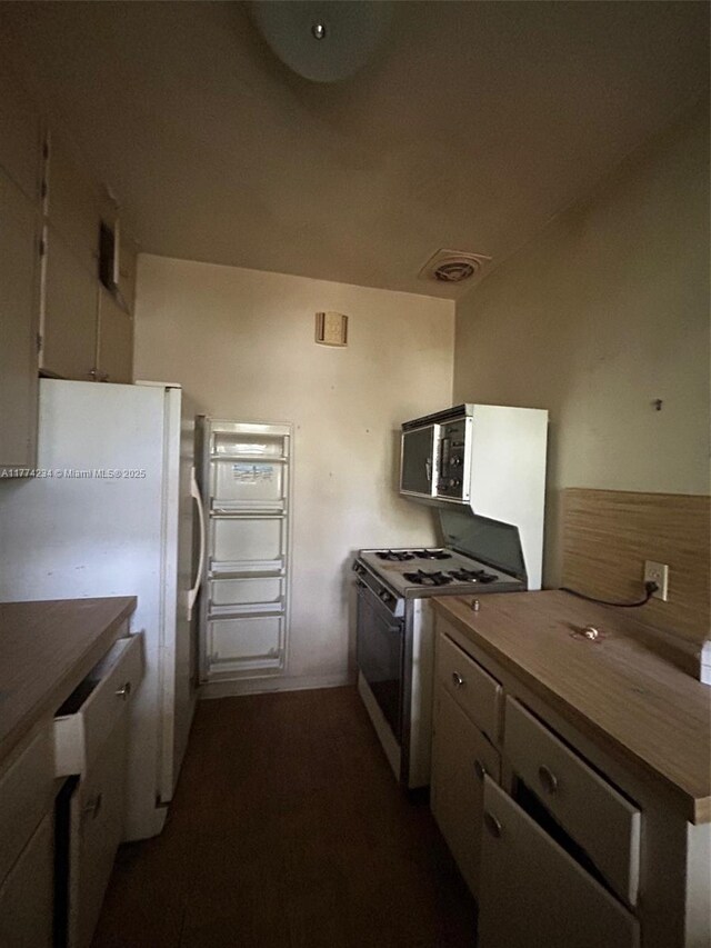 3401 SW 14th St, Miami, FL 33145 - kitchen with white appliances and dark wood-style flooring