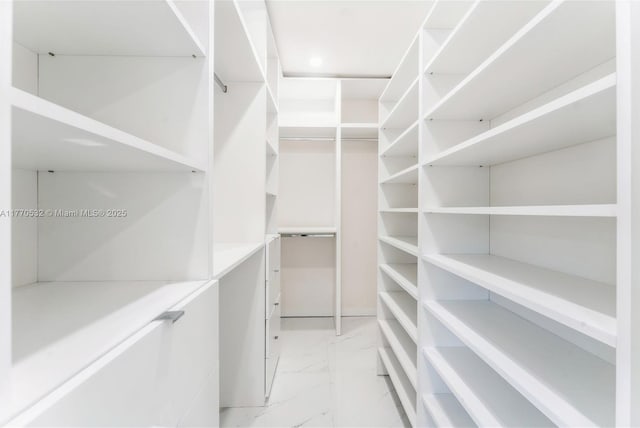 1446 Scott St, Hollywood, FL 33020 - walk in closet featuring marble finish floor