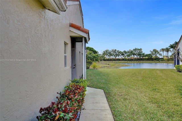 view of yard with a water view