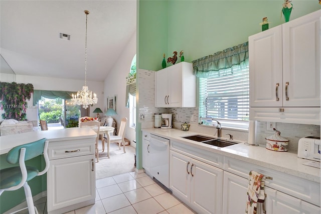 kitchen featuring dishwasher, a sink, visible vents, and a healthy amount of sunlight