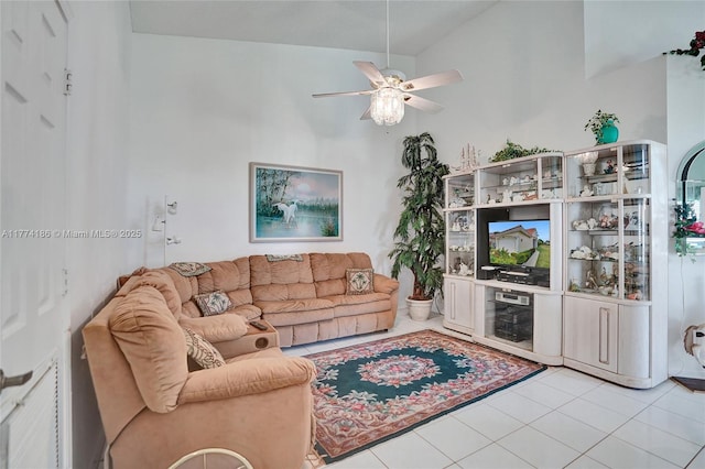 living room featuring light tile patterned floors and a ceiling fan