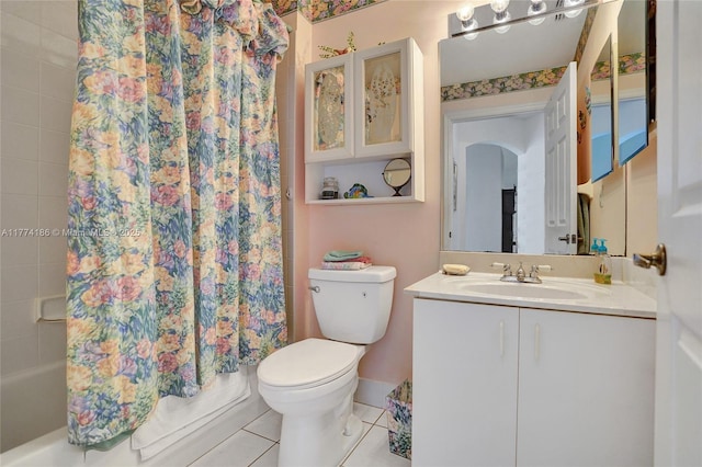 bathroom featuring toilet, shower / tub combo, vanity, and tile patterned flooring