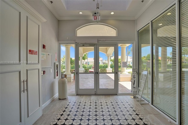 entryway featuring recessed lighting, french doors, a high ceiling, and crown molding