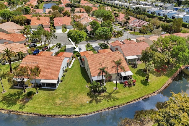 aerial view featuring a water view and a residential view