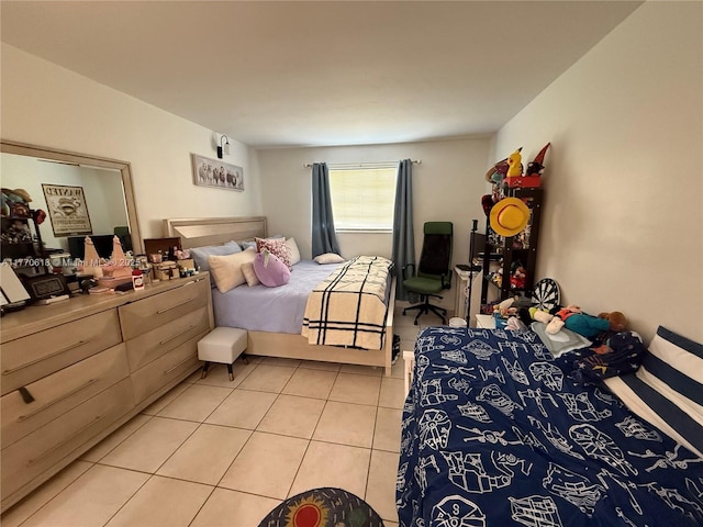 bedroom featuring light tile patterned flooring