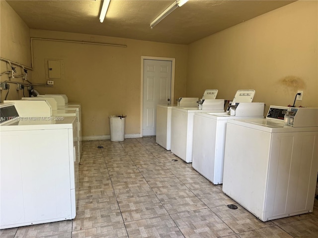 common laundry area with washing machine and clothes dryer
