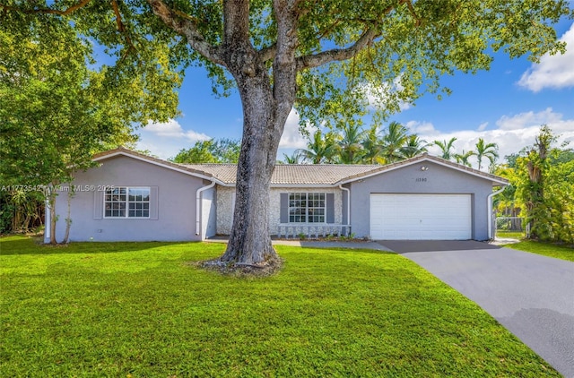 11390 NW 37th St, Coral Springs, FL 33065 - ranch-style home with stucco siding, an attached garage, a front yard, and driveway