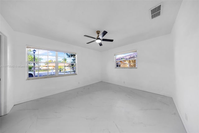 11390 NW 37th St, Coral Springs, FL 33065 - empty room featuring marble finish floor, ceiling fan, and visible vents