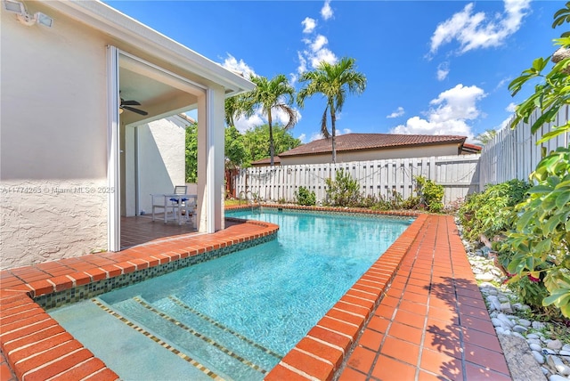 519 SW 88th Pl E, Miami, FL 33174 - view of pool with a fenced backyard and a ceiling fan