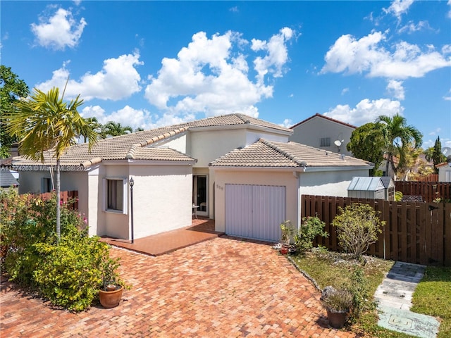 519 SW 88th Pl E, Miami, FL 33174 - mediterranean / spanish house with a garage, decorative driveway, stucco siding, and a tile roof