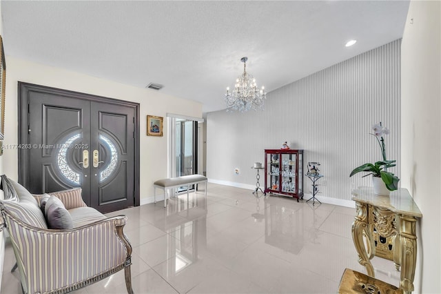 519 SW 88th Pl E, Miami, FL 33174 - living area with a chandelier, light tile patterned floors, and french doors