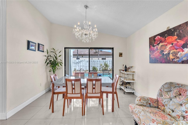 519 SW 88th Pl E, Miami, FL 33174 - dining area with a chandelier, lofted ceiling, light tile patterned floors, baseboards, and a textured ceiling