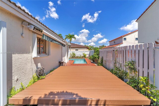 519 SW 88th Pl E, Miami, FL 33174 - wooden deck with a fenced backyard