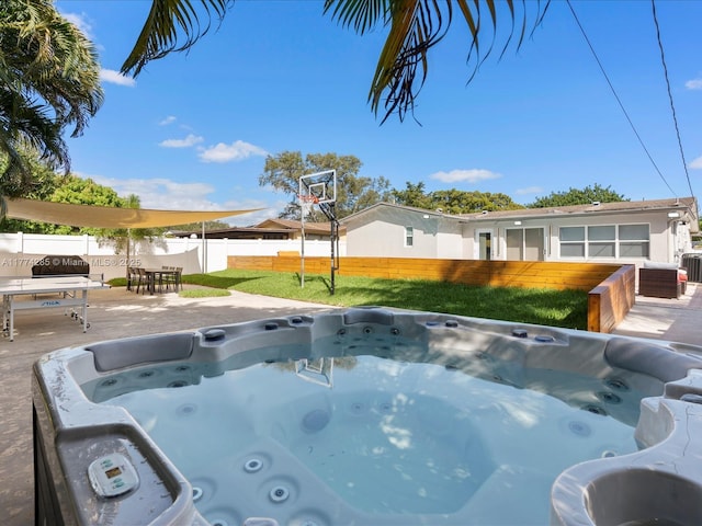 4991 SW 29th Way, Dania Beach, FL 33312 - view of swimming pool featuring a hot tub and central AC