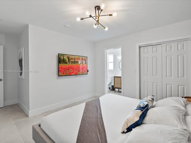 4991 SW 29th Way, Dania Beach, FL 33312 - bedroom with a chandelier, a closet, and baseboards