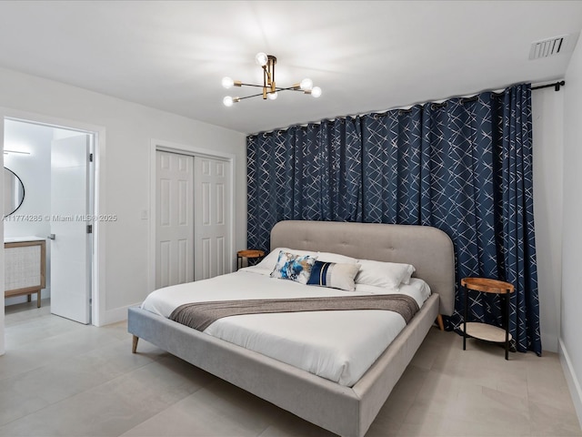 4991 SW 29th Way, Dania Beach, FL 33312 - bedroom featuring a chandelier, a closet, and baseboards