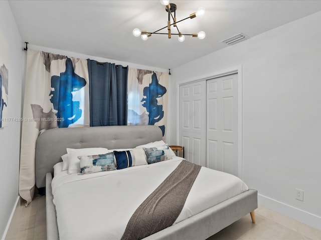 4991 SW 29th Way, Dania Beach, FL 33312 - bedroom with baseboards, a chandelier, and a closet