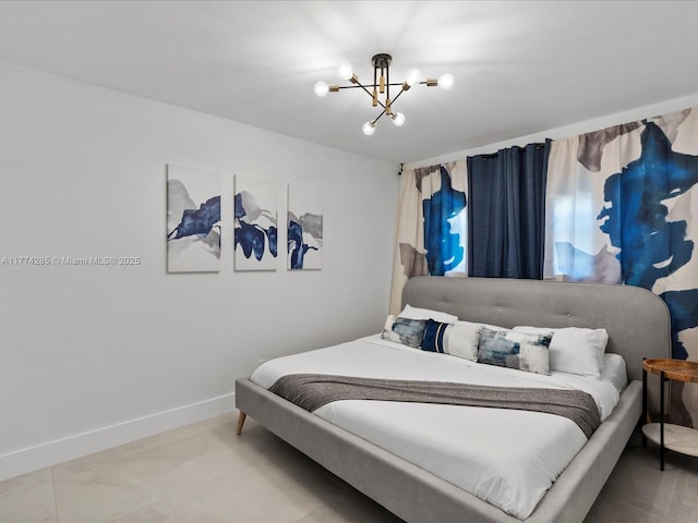 4991 SW 29th Way, Dania Beach, FL 33312 - bedroom with a chandelier, baseboards, and tile patterned floors