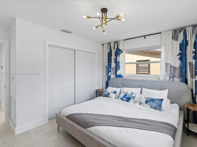 4991 SW 29th Way, Dania Beach, FL 33312 - bedroom featuring a closet and a chandelier