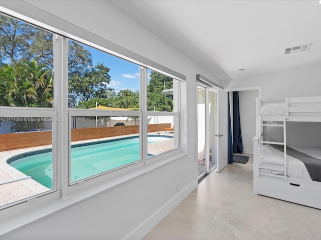 4991 SW 29th Way, Dania Beach, FL 33312 - unfurnished bedroom with multiple windows and baseboards