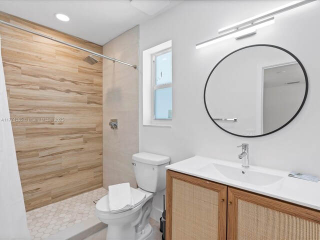 4991 SW 29th Way, Dania Beach, FL 33312 - bathroom featuring toilet, tiled shower, and vanity