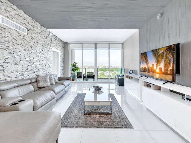 100 Bayview Dr Unit Ph01, Sunny Isles Beach, FL 33160 - living area featuring light tile patterned flooring and a wall of windows