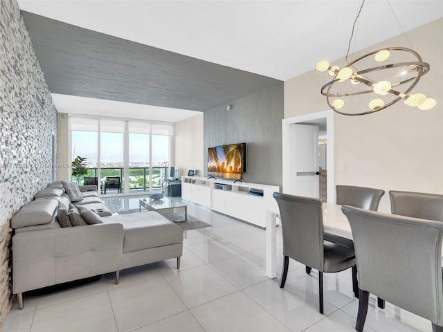 100 Bayview Dr Unit Ph01, Sunny Isles Beach, FL 33160 - living area featuring floor to ceiling windows, an accent wall, light tile patterned floors, and a chandelier