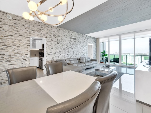100 Bayview Dr Unit Ph01, Sunny Isles Beach, FL 33160 - dining space featuring light tile patterned floors, a notable chandelier, and visible vents